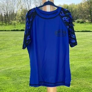 Ron Jon Surf Shop: Boy’s short sleeve rash guard top in blue and black. Size 12.